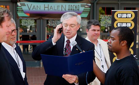 George Heartwell (the Grand Rapids mayor), in front of the Van Andel Arena, renamed it Van Halen Arena, but only for today in honor of the band's show - © Press Photo / Adam Bird