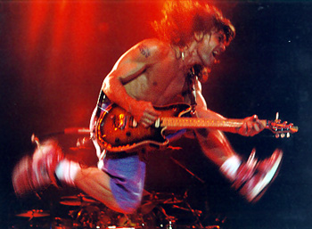 Edward Van Halen running and jumping onstage